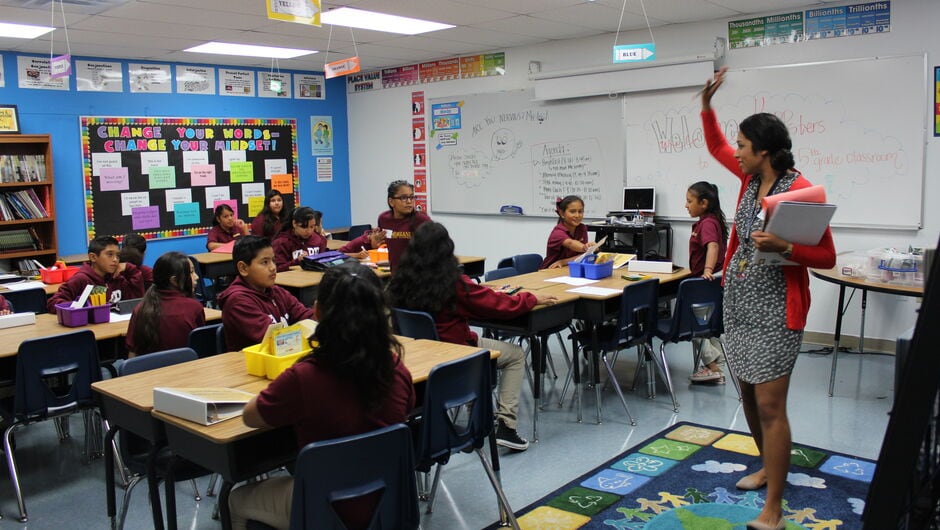 A Teach For America corps member leading a class of students.