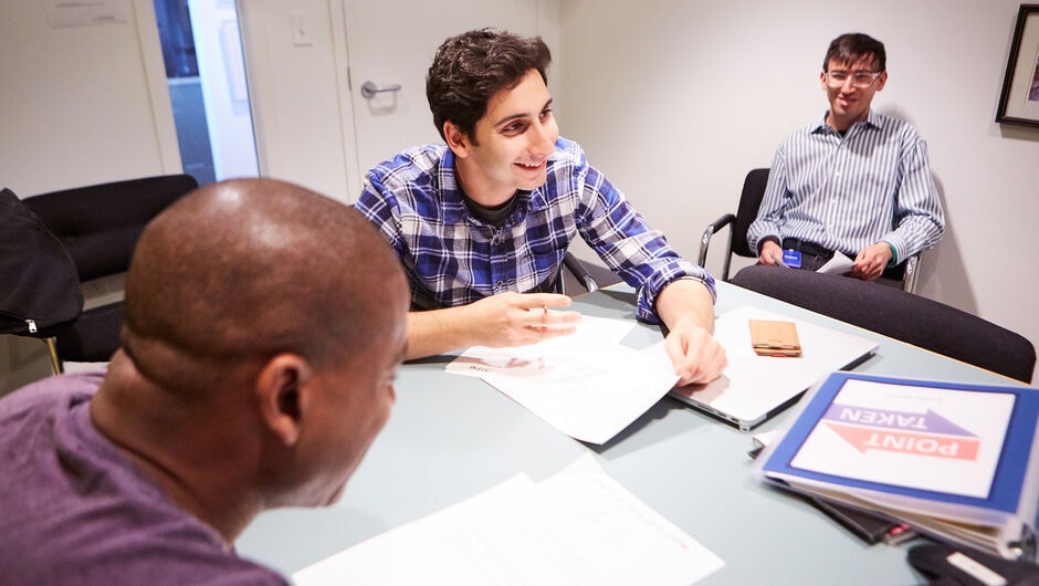 Person siting at a conference table