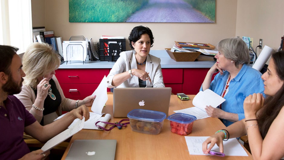 Educator working together in a conference room.