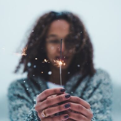 Young person holding sparkler