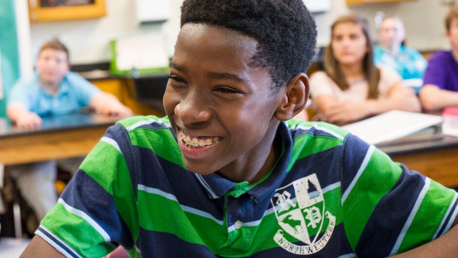 Alt text: A student at his desk