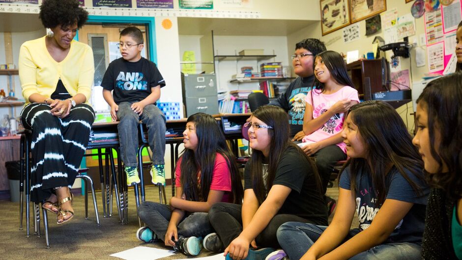 Teach For America teacher with young students
