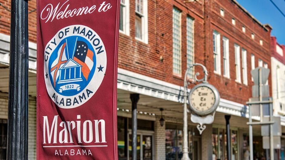 Brick buildings line a main street.