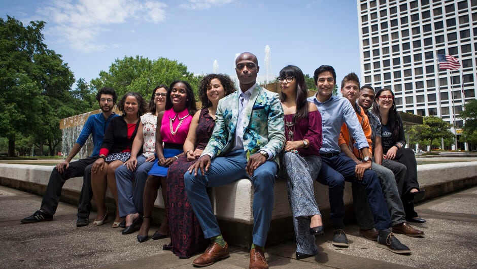 Diverse group of people sitting and facing camera