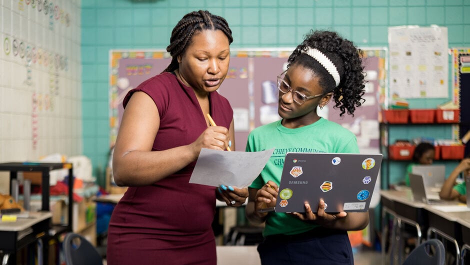 Teacher giving instruction to student