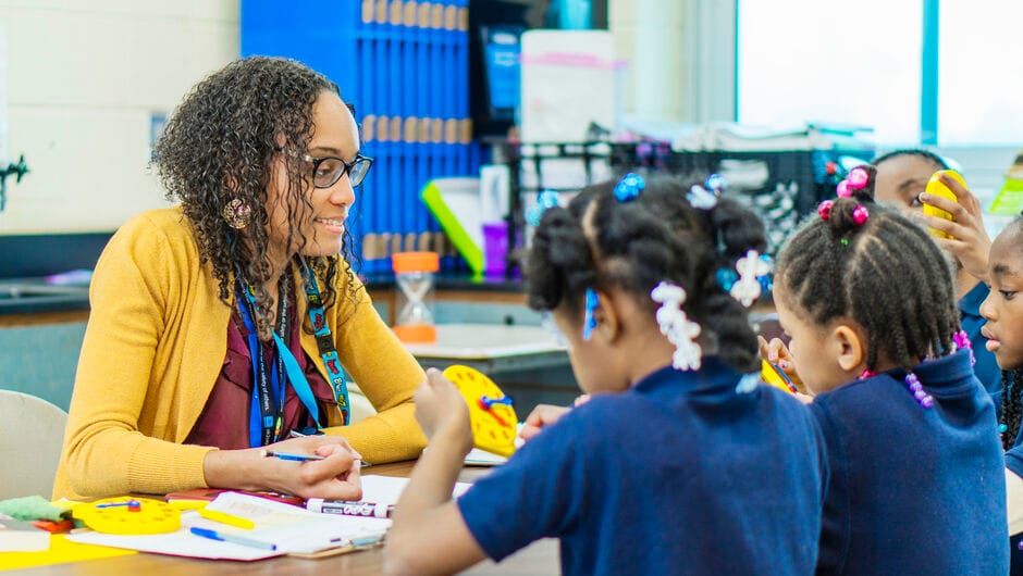 Teacher with students in classroom