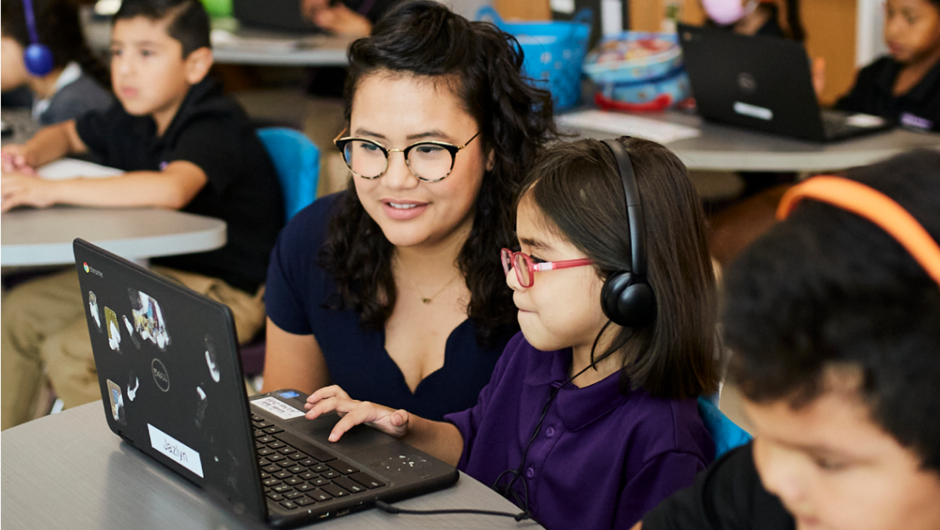 tutor and student working together on laptop